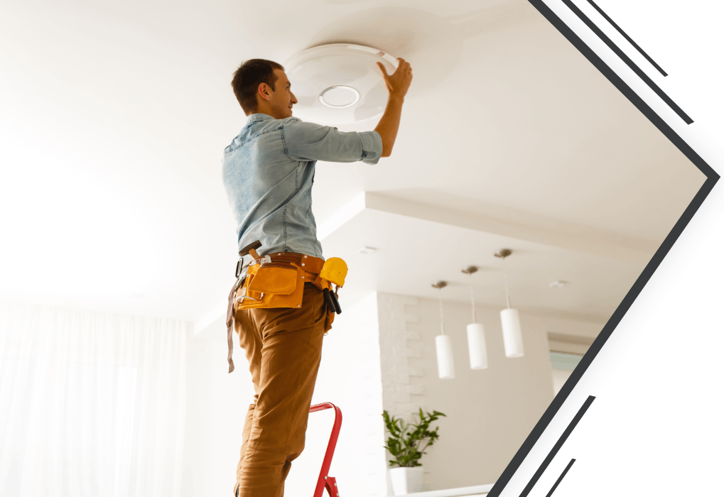 Electrician changing lamp